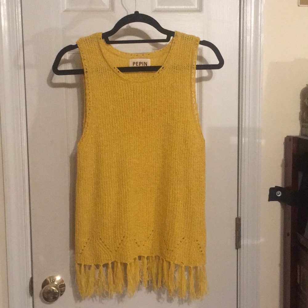 Bright yellow knit top with tassels